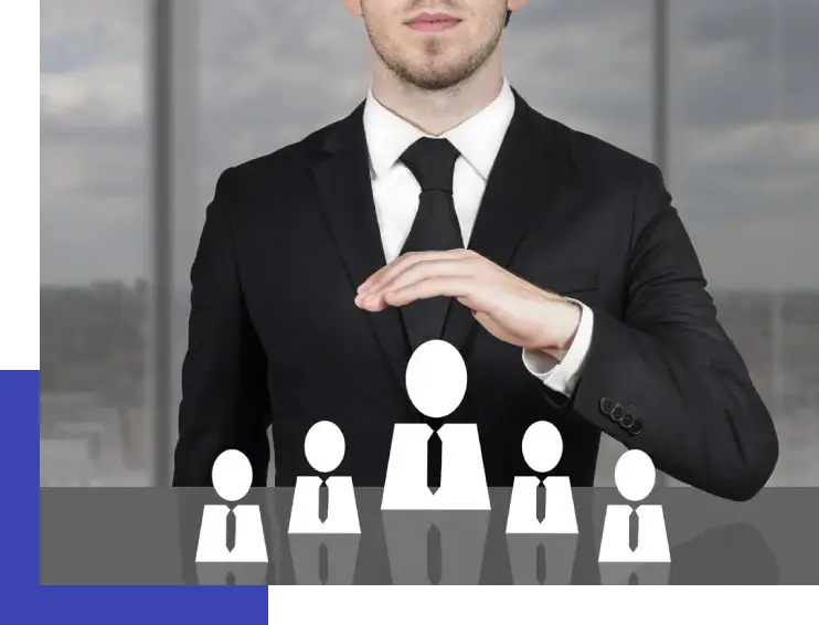 A man in a suit and tie holding out his hand to show the people behind him.